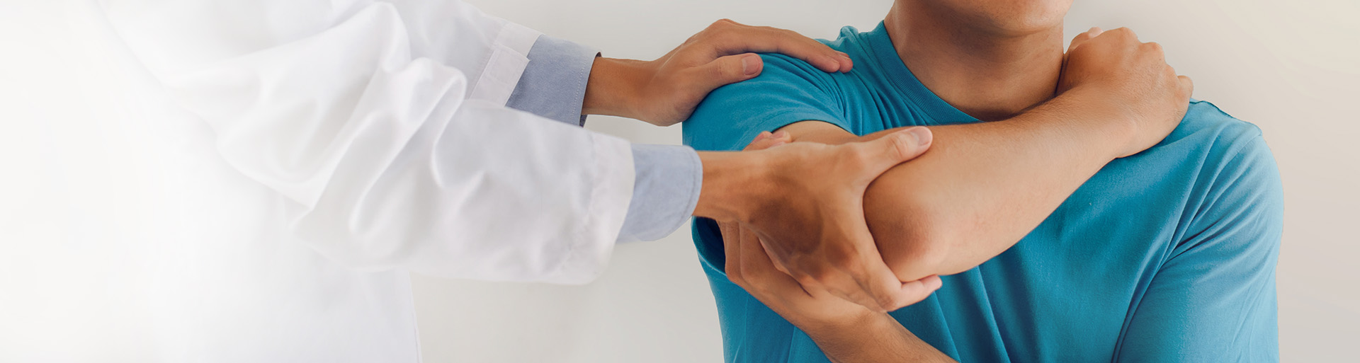 therapist helping a patient with a sports injury